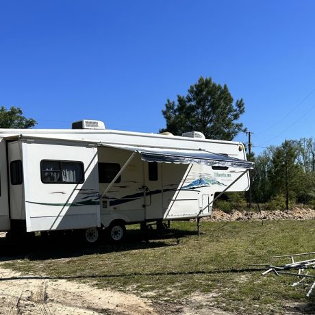 View of an RV site at Hat Creek RV Park in Cottondale, FL