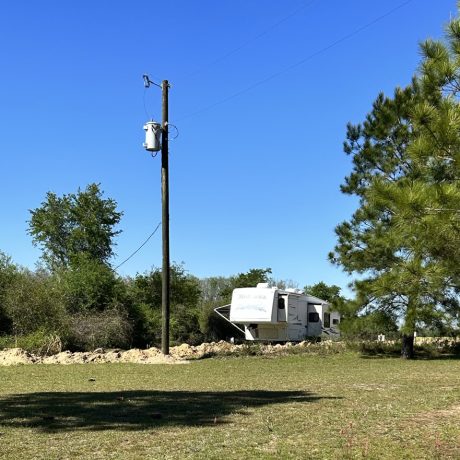 View of an RV site at Hat Creek RV Park in Cottondale, FL